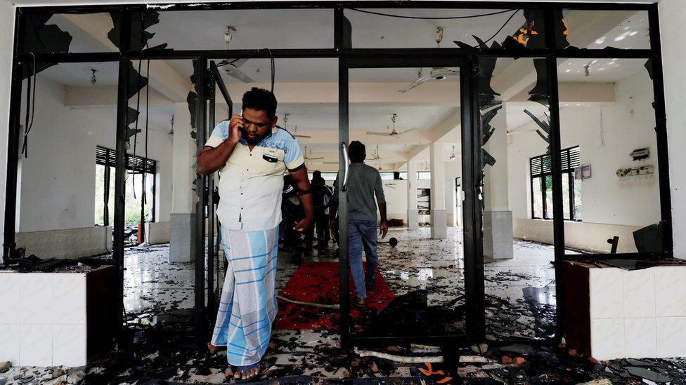 A Muslim man reacts inside the Abbraar Masjid mosque after an attack in Kiniyama