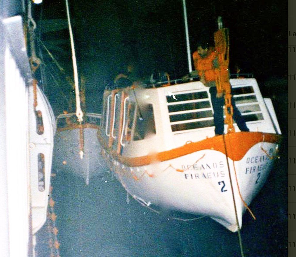 A lifeboat hangs on the portside of the Oceanos