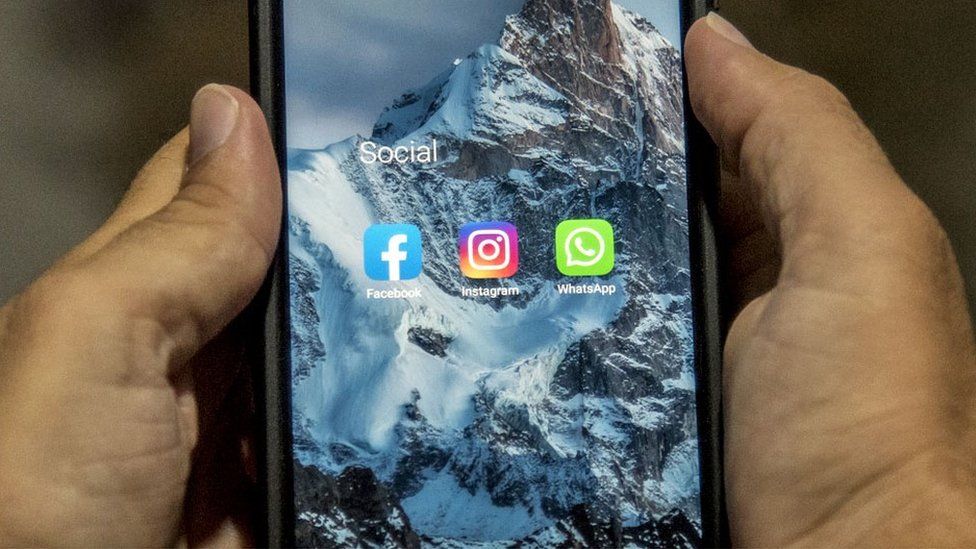 The icons of Facebook, Instagram, and Whatsapp are seen on a mobile phone on October 05, 2021