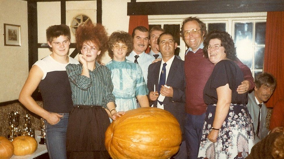 Kevin's dad Mike (second from right) with his family at a pumpkin championship in the 1980s