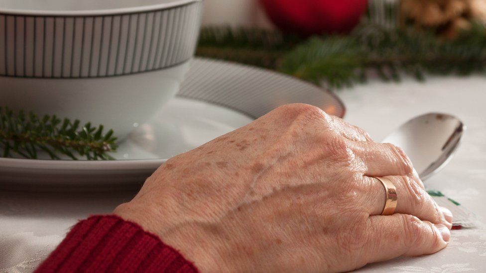 elderly lady eating Christmas lunch