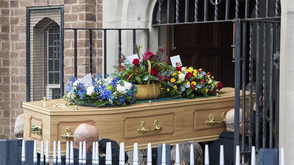 Coffin carried into church for the funeral of Jessica Baker