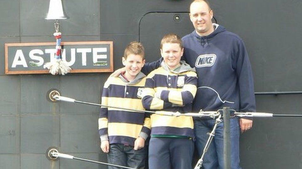 Ian Molyneux with two of his sons on board HMS Astute