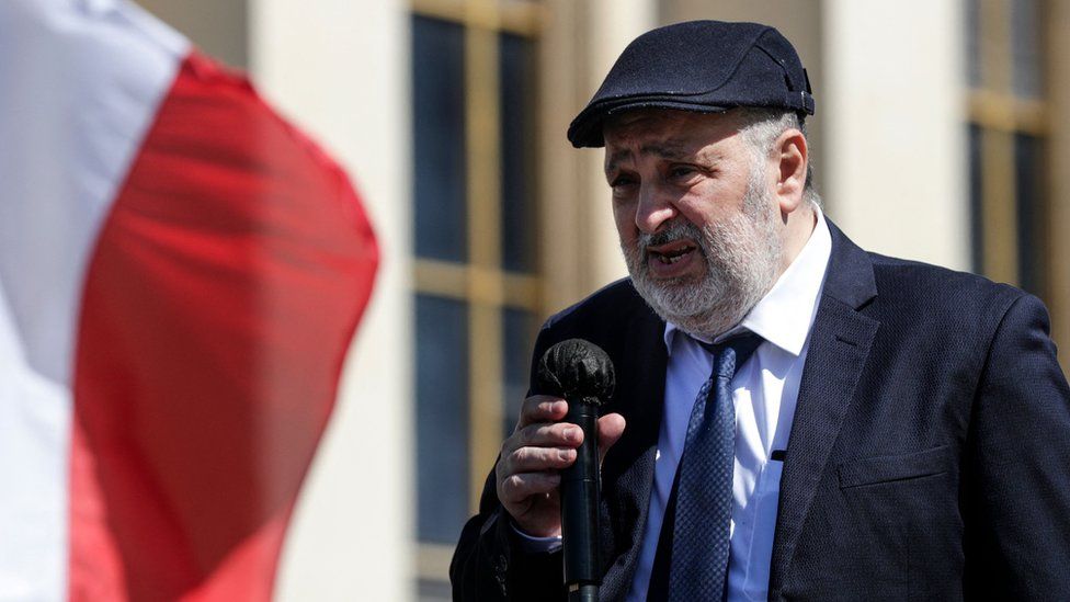 William Attal, the brother of late Sarah Halimi, delivers a speech as people gather to ask justice on Trocadero plaza in Paris on April 25, 2021