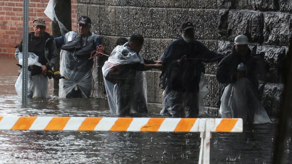 Residents escape the rising floodwaters in New York City