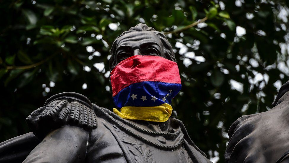 View of the statue of Venezuela's liberator Simon Bolivar with a Venezuelan national flag used as mask in Caracas, on August 5, 2017