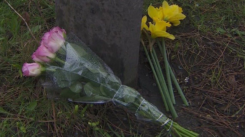 Flowers left near the scene of the crash