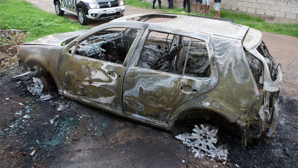 A car abandoned and burnt thought to belong to the perpetrators of the club shooting, in Fortaleza, Brazil, 27 January 2018.