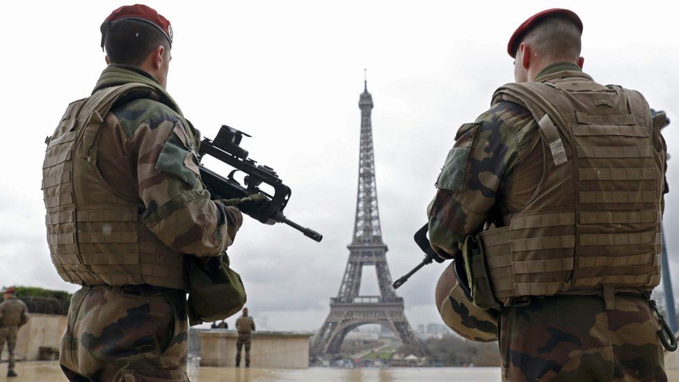 French army paratroopers patrol near the Eiffel Tower in Paris, in this picture taken on 30 March 2016.