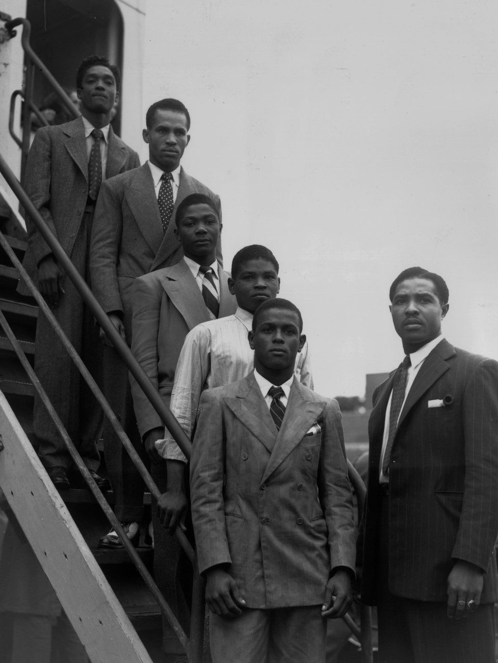 Hopeful Jamaican boxers Charles Smith, Ten Ansel, Essi Reid, John Hazel, Boy Solas and manager Mortimer Martin arrive at Tilbury on the Emire Windrush, 22 June 1948