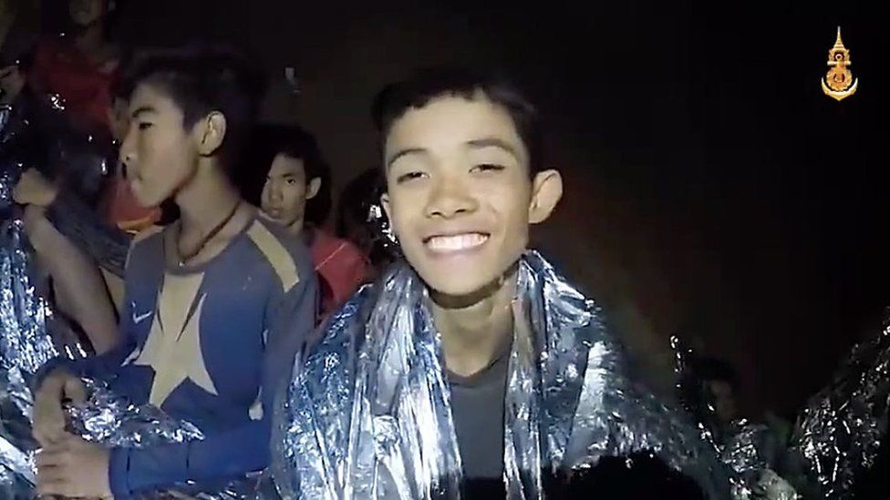 A video grab handout made available by Thai Royal Navy shows some of the members of a trapped soccer team in a section of Tham Luang cave in Khun Nam Nang Non Forest Park on July 04, 2018 in Chiang Rai, Thailand.