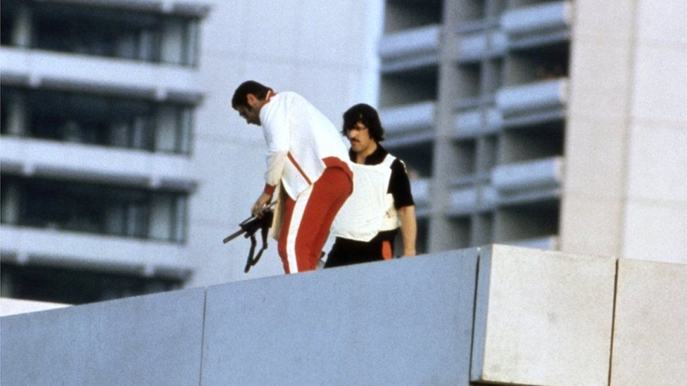 Armed police officers, disguised as Olympic competitors, on the roof of the Israeli housing, during the Munich Olympics siege, 6 Sept 1972