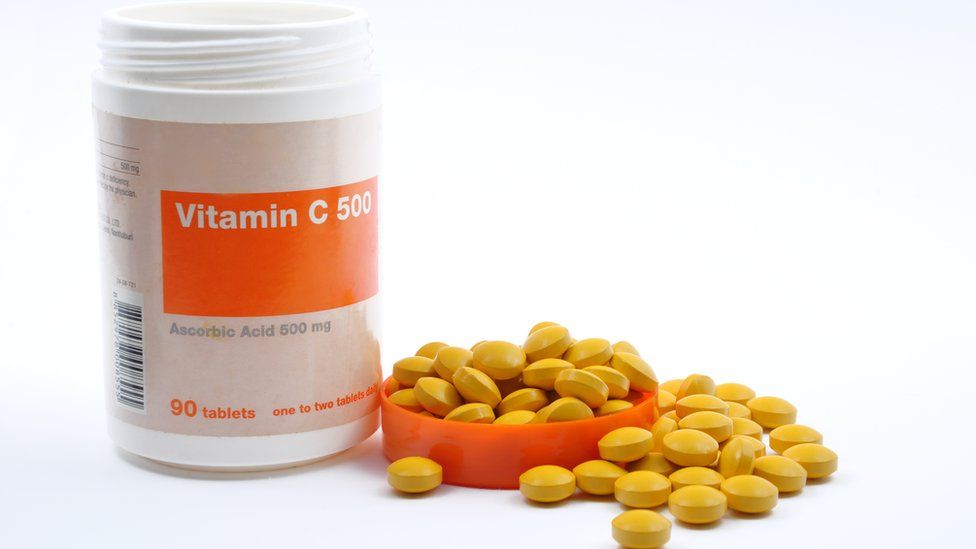 Vitamin C bottle with pills