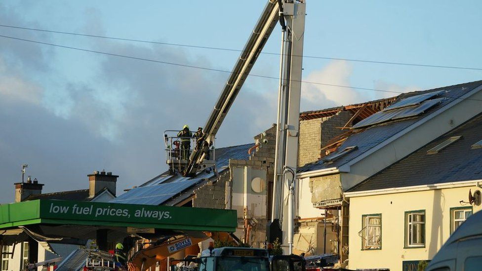 firemen at scene of Creeslough incident