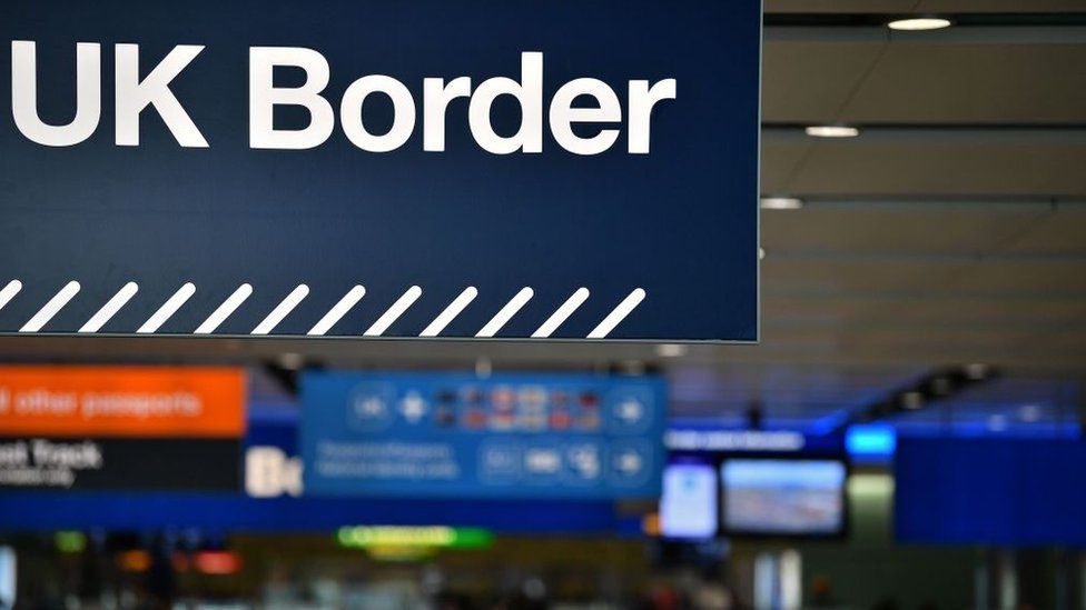 UK border signs are pictured at the passport control in Arrivals at Heathrow Airport