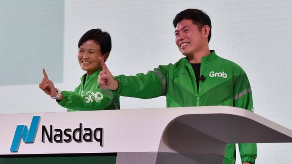 Grab CEO Anthony Tan and co-founder Tan Hooi Ling at the Grab Bell Ringing Ceremony at a hotel in Singapore.