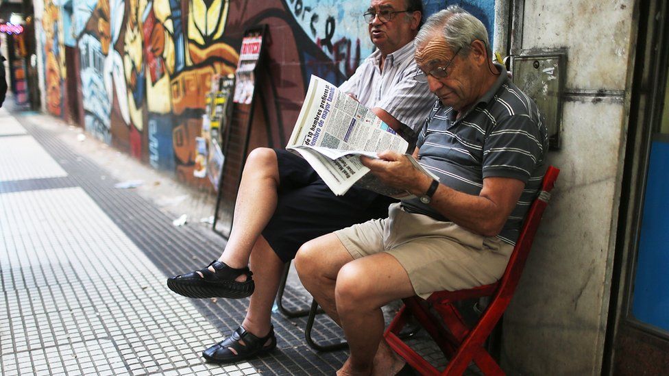 Man reads a newspaper in the Argentine capital Buenos Aires.