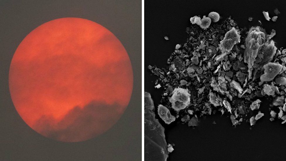 Red sun in sky and dust under microscope