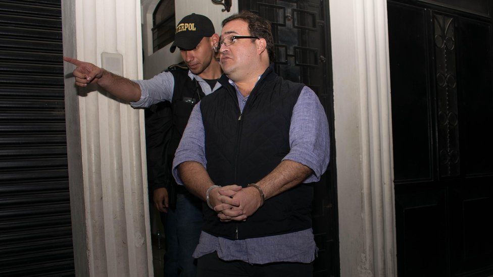 The handcuffed Javier Duarte, former governor of the Mexican state of Veracruz, is escorted by police following his arrest in Panajache municipality