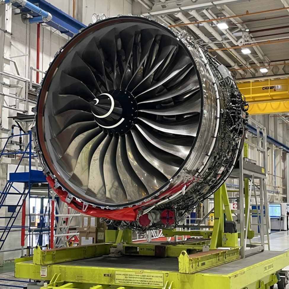 A Rolls Royce airplane-sized engine on the factory floor