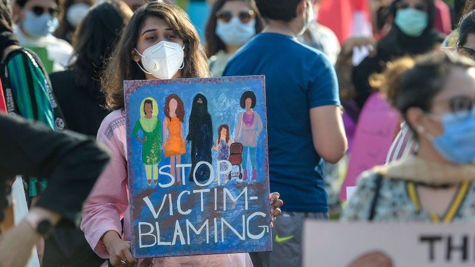 Human rights activists carry placards as they take part in a protest against an alleged gang rape of a woman, in Islamabad on September 12, 2020.