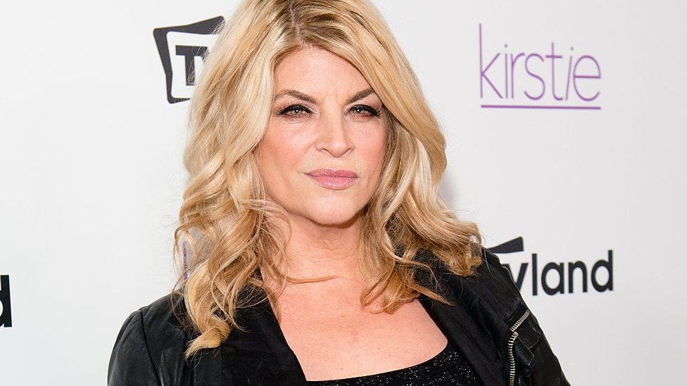 Kirstie Alley on a red carpet in 2013