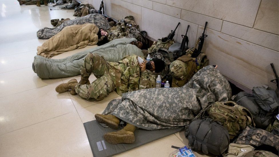 Members of the National Guard rest in the Capitol Visitor Center on Capitol Hill in Washington, DC, USA, 22 January 2021