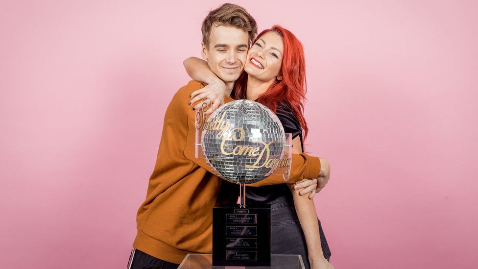 Joe Sugg and Dianne Buswell with the glitter ball