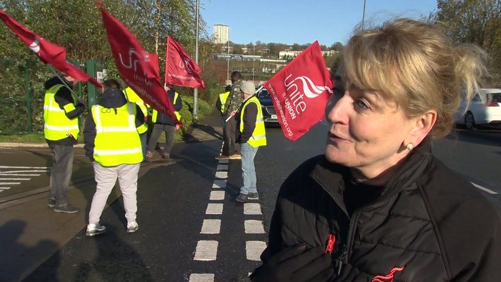 Sharon Graham, Unite, standing in from of protestors with union flags