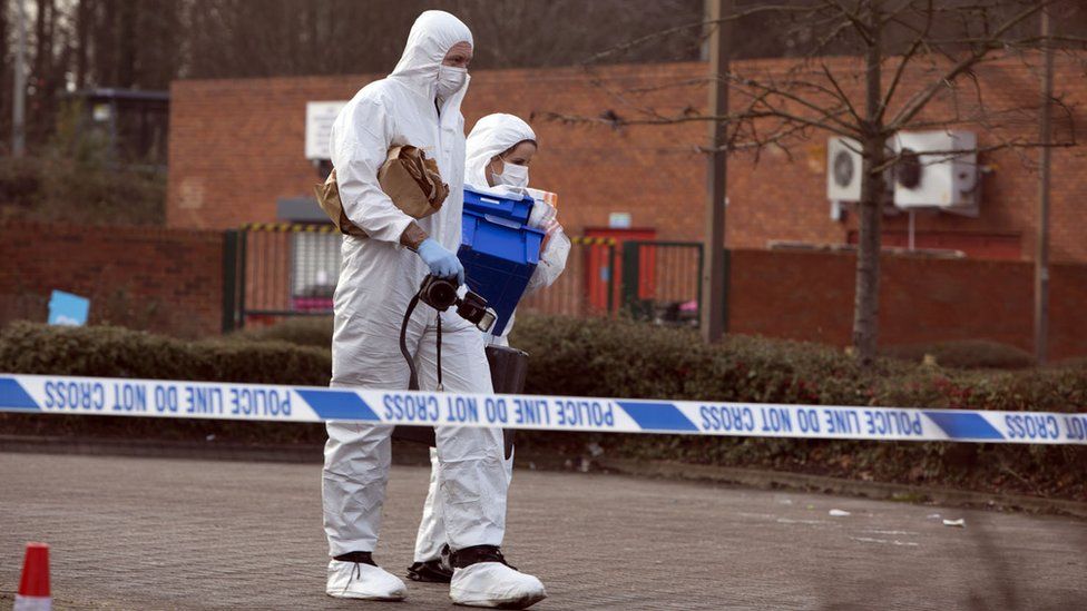 Police forensic officers at the death scene