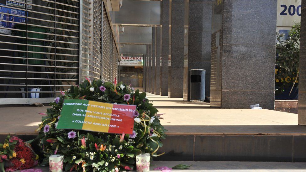 Flowers have been laid at the entrance the Radisson Blu hotel in Bamako on 24 November 2015