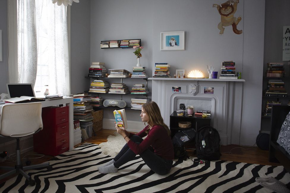 Maddie reads in her room