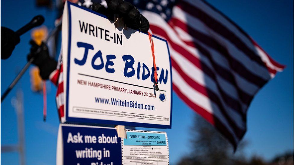 A sign encourages New Hampshire voters to write in Joe Biden on Tuesday's ballot