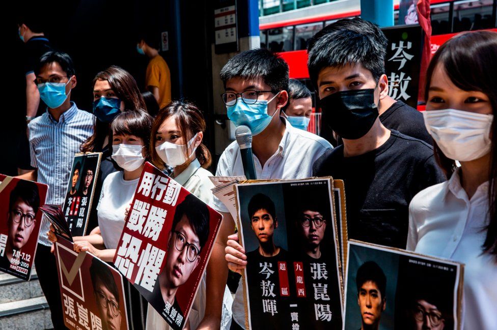 (L-R) Pro-democracy activists Eddie Chu, Gwyneth Ho, Leung Hoi-ching, Tiffany Yuen, Joshua Wong, Lester Shum and Agnes Chow campaign during primary elections in Hong Kong on July 12, 2020.