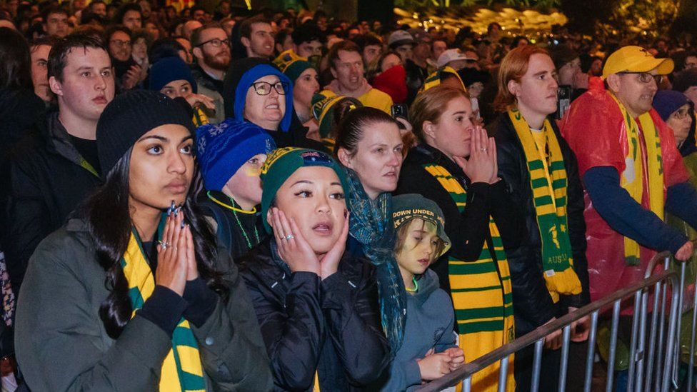 Fans hold their breath during the Australia v France penalty shootout on Saturday, at Melbourne's Federation Square