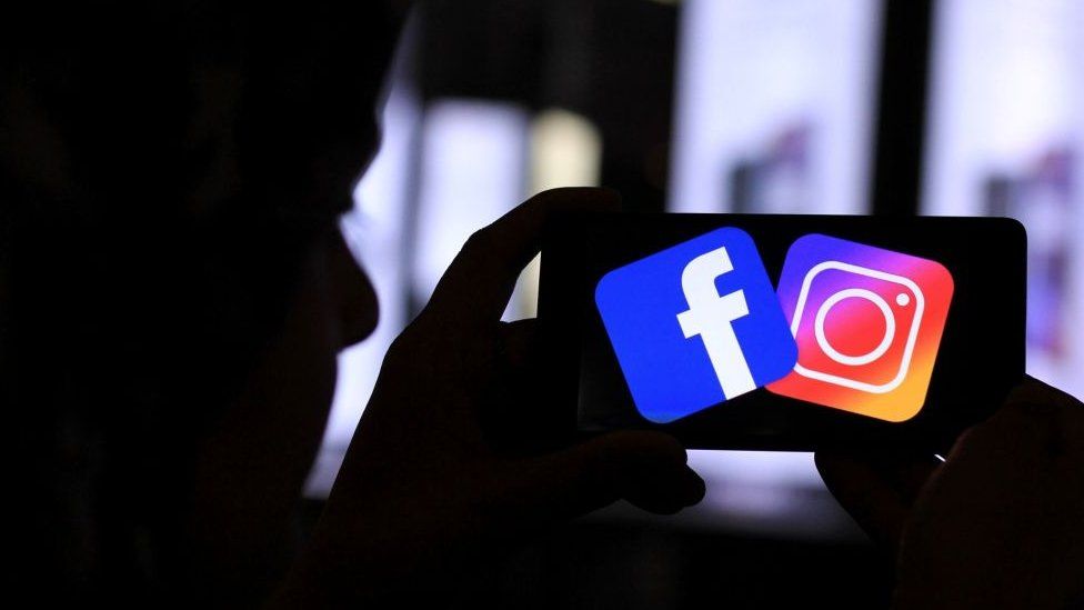 Facebook and Instagram logo is seen on a mobile phone , on March 17, 2019