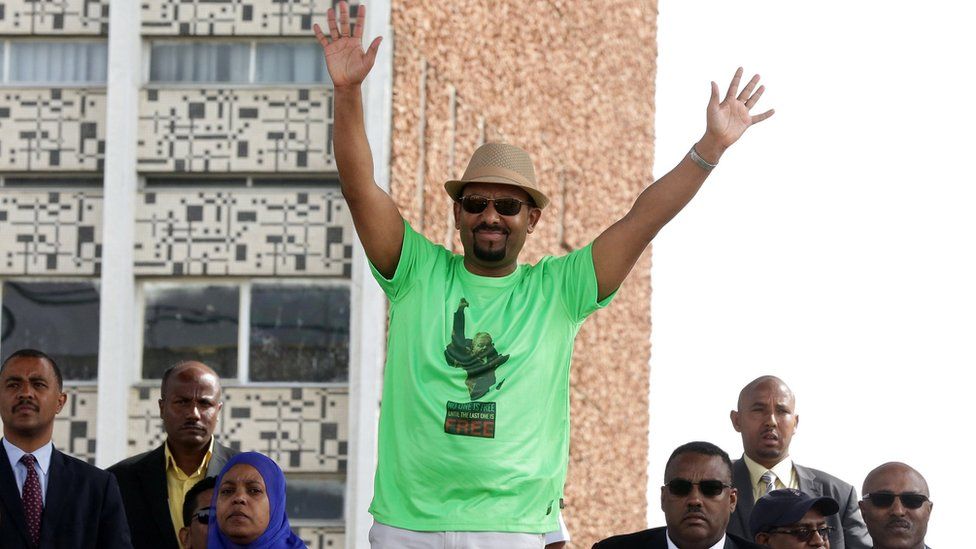 Mr Abiy waves during his speech
