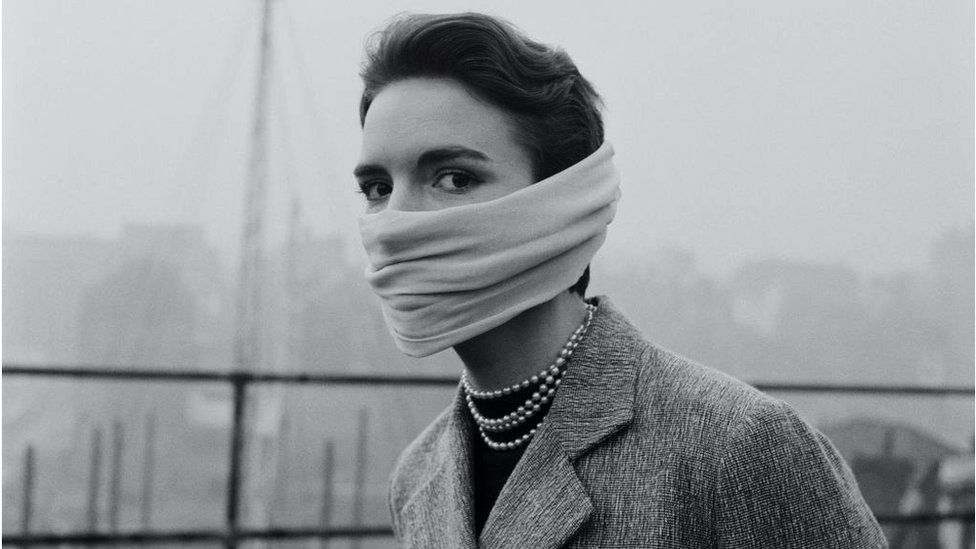 woman wearing smog mask in 1953