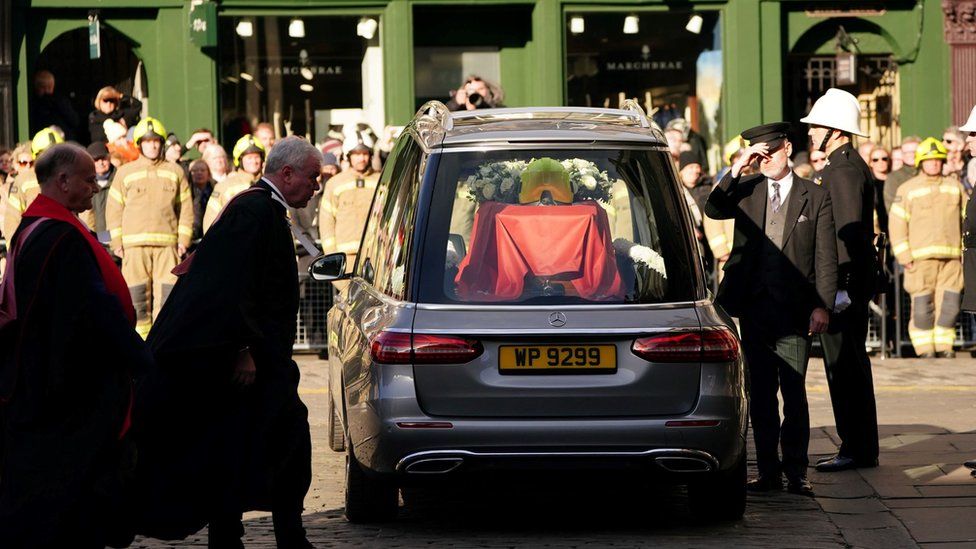 The coffin in a hearse