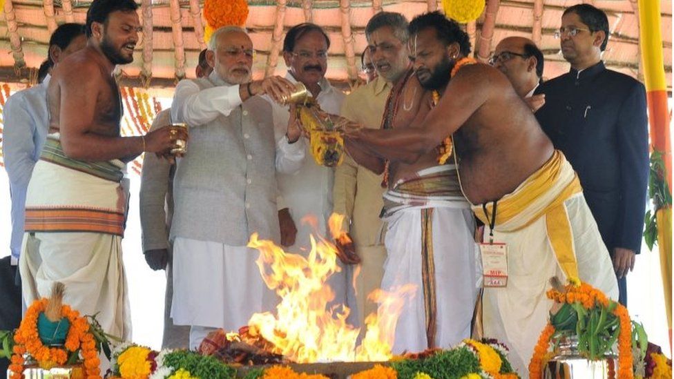 Indian Prime Minister Narendra Modi (2nd L) performs a pooja ritual at the foundation stone laying ceremony in Amaravati, the new capital of Andhra Pradesh.