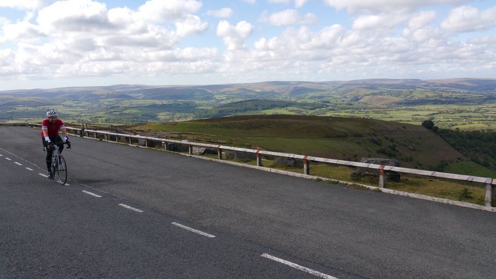 Will Smale cycling in the Wales' Cambrian mountains
