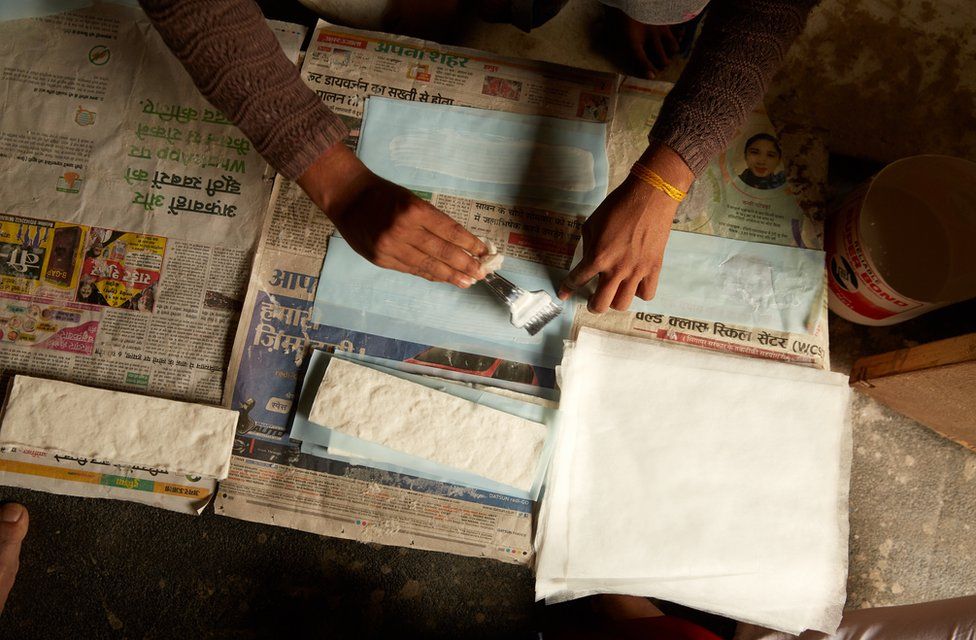 Women making sanitary pads
