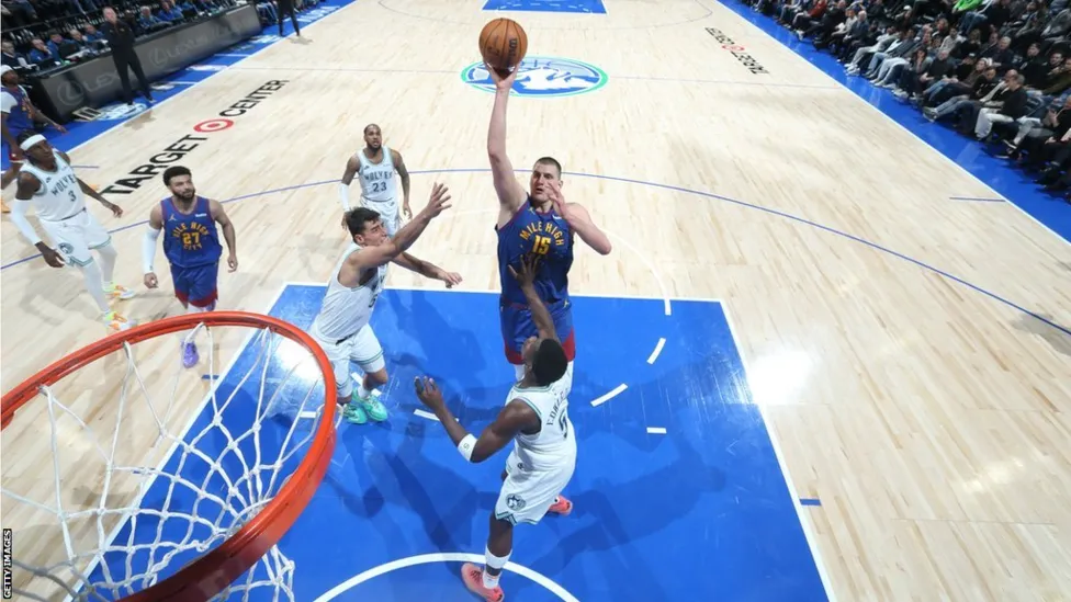 Jokic Shines with 35 Points as Denver Nuggets Outlast Minnesota Timberwolves in NBA Clash.