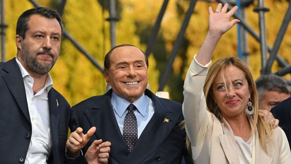 (L-R) Lega leader Matteo Salvini, Forza Italia leader Silvio Berlusconi and Brothers of Italy leader Giorgia Meloni acknowledge applause on stage on September 22, 2022