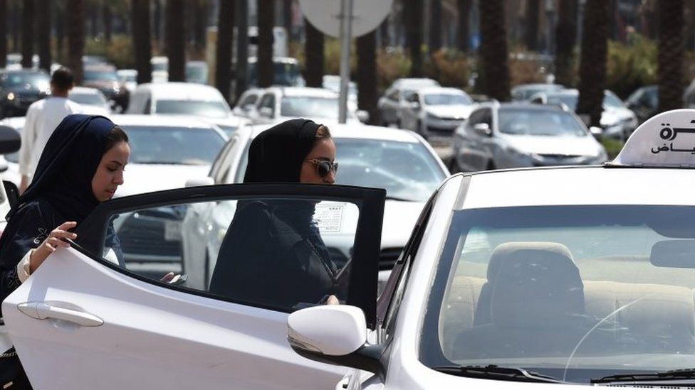 Saudi women get into a taxi at a street in the Saudi capital Riyadh. Photo: 28 September 2017