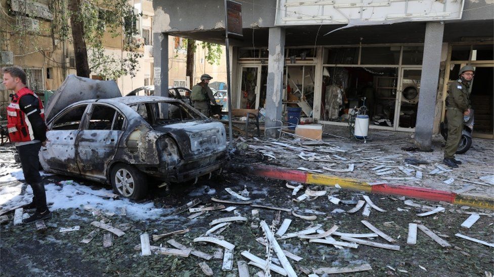 Damage to shops and cars in Ramat Gan, near Tel Aviv, after a rocket fired from Gaza hit the area, May 2021