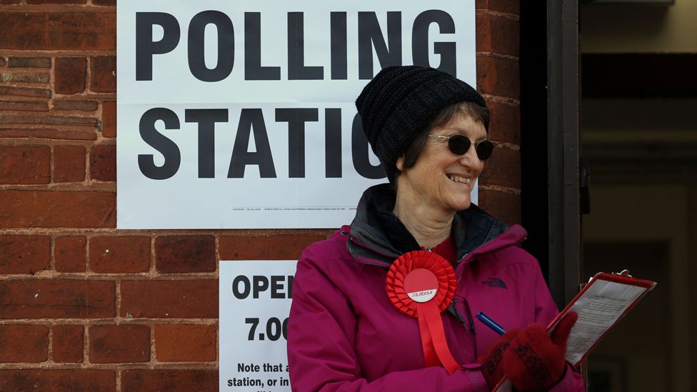 A Labour party Teller outside Trumpington village hall in Cambridgeshire, as voters cast their ballots in local council elections.