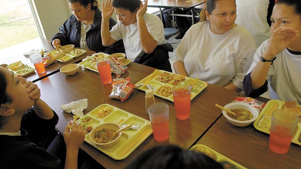 Women prisoners e talk over lunch 31 January, 2002 at the Leo Chesney Correctional facility in Live Oak, CA.
