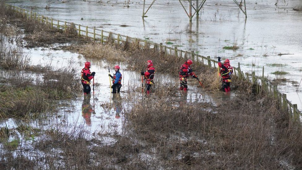 Search crews look for the boy in waters near the river