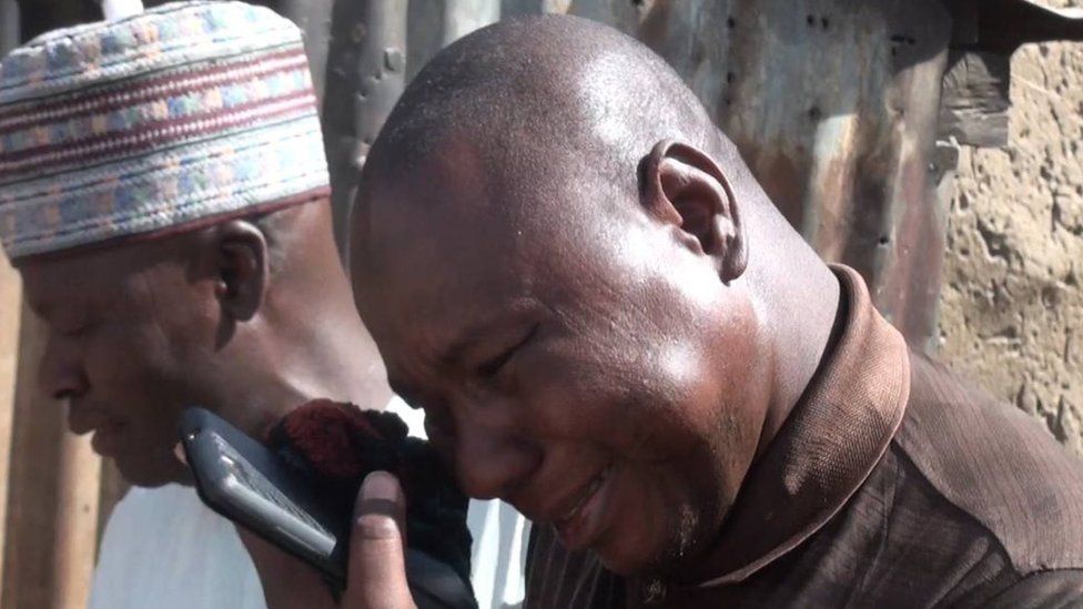 A man wipes away a tear after the girls were released in Dapchi